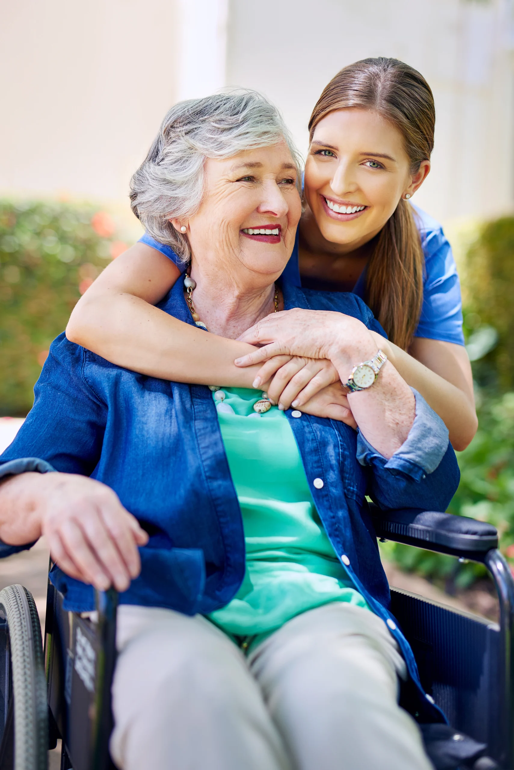 lady in bed looks up thankfully at caregiver